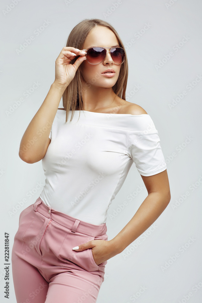 Fashion portrait of a young woman in sunglasses Fashion portrait of a young woman in sunglasses
