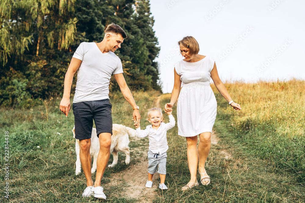 Young happy family with dog have fun outdoor