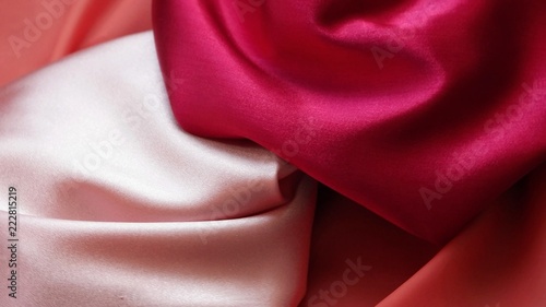 Pink, coral and crimson satin, drapery, textile background