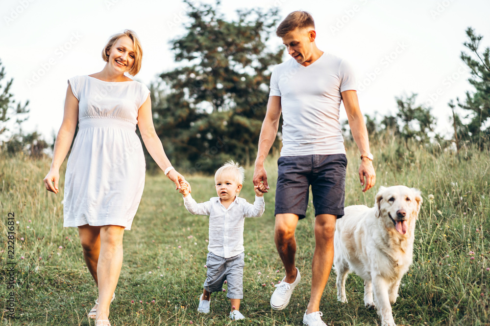 Young happy family with dog have fun outdoor Young happy family with dog have fun outdoor