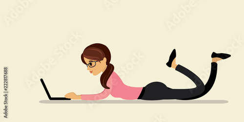Caucasian businesswoman or freelancer lies and works on a laptop,
