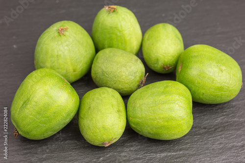 nergi mini kiwi berries on black background photo