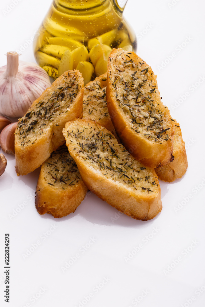 fragrant garlic bread on a white acrylic background