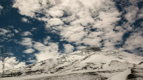 Cotopaxi Volcano after a heavy snowfall. Situated in the Ecuadorian Andes, at 5897m is one of the worlds highest volcanoes. Vapour is emanating from fumaroles near the summit. photo