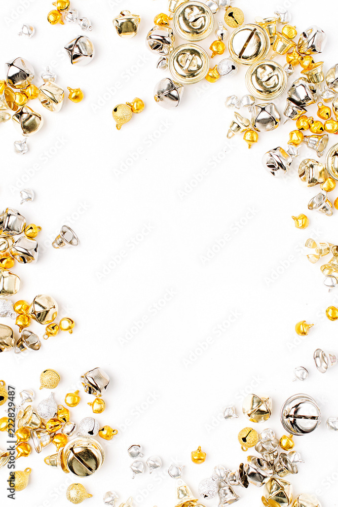 Gold and silver Jingle bells Christmas background. Flat lay, top view