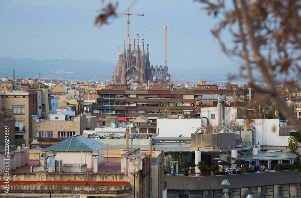 Barcelona roofs against background of Sagrada Familia