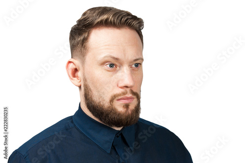 Portrait of young man dressed on a blue classic shirt. Businessman isolated on a white background.