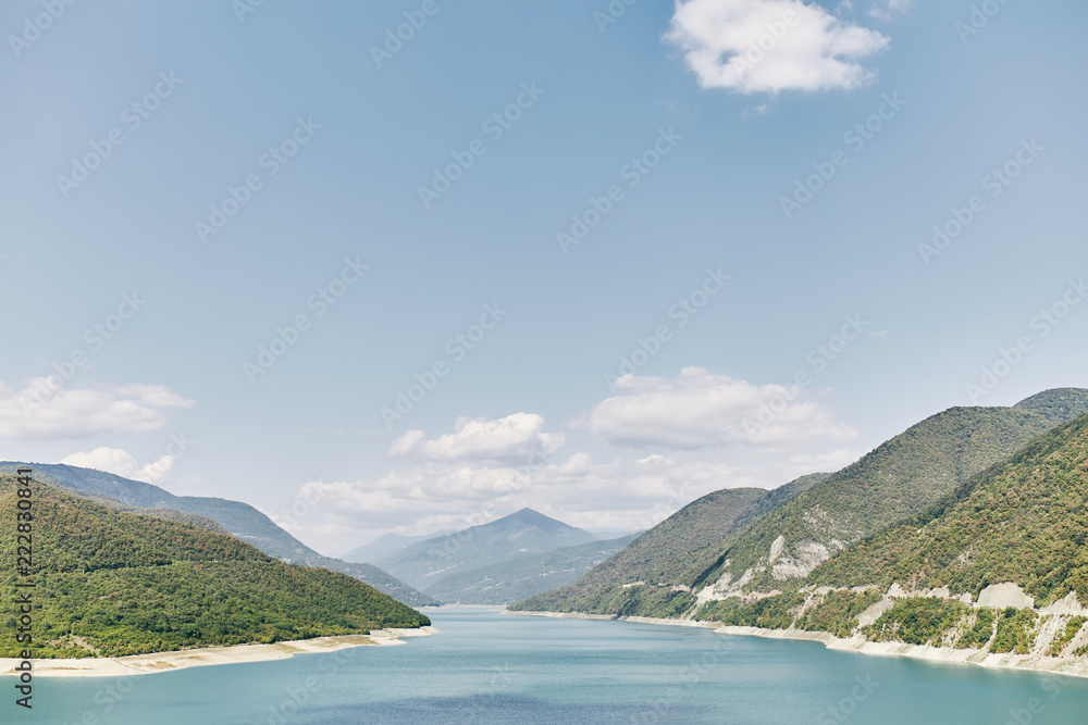 Landscape of Zhinvali reservoir lake landscape with mountains . The main Caucasus ridge. 