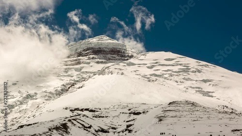 The summit of Cotopaxi Volcano after a heavy snowfall, Time-lapse. With climbers making their way upslope to the refuge. Situated in the Ecuadorian Andes, at 5897m one of the worlds highest volcanoes