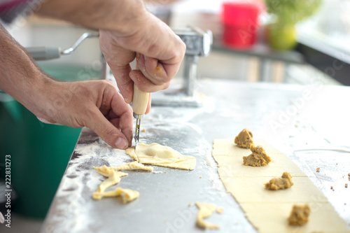 Chef prepared homemade raw tortellini pasta. Italian pasta,gluten-free
