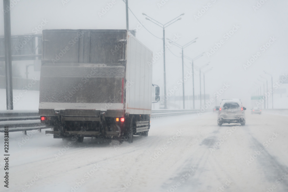 Truck drives through cold weather conditions