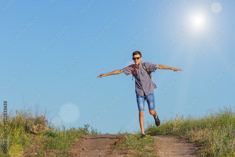 guy jumping to the top on the road, travel concept guy jumping to the top on the road, travel concept