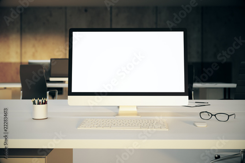 Empty white computer on office table