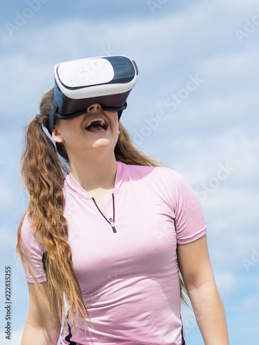 Woman wearing VR outside