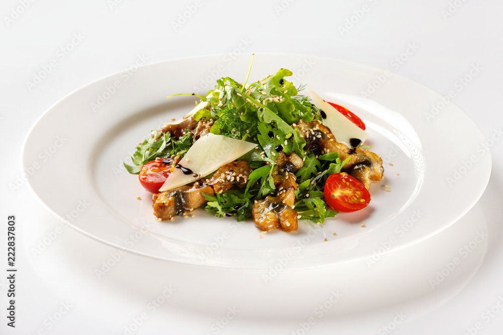 Plate with fried chicken meat served with salad, tomato, parmesan and sauce isolated at white background. Plate with fried chicken meat served with salad, tomato, parmesan and sauce isolated at white background.