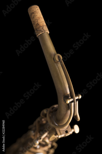 Fototapeta Naklejka Na Ścianę i Meble -  Matte finish saxophone neck, pipe line on black background