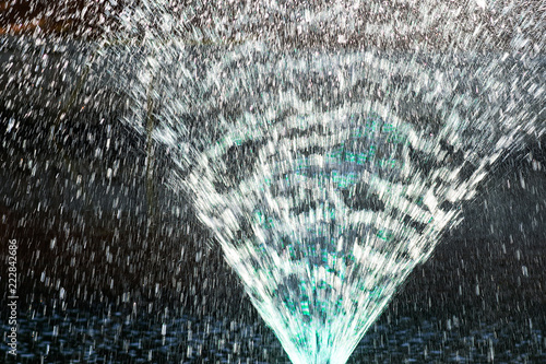 Fountain water jets in the sun