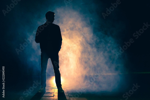 The man standing in the fog. evening night time