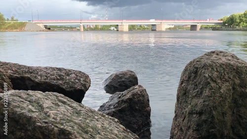 River, bridge, rocks, clouds. Vyborg. Russia.