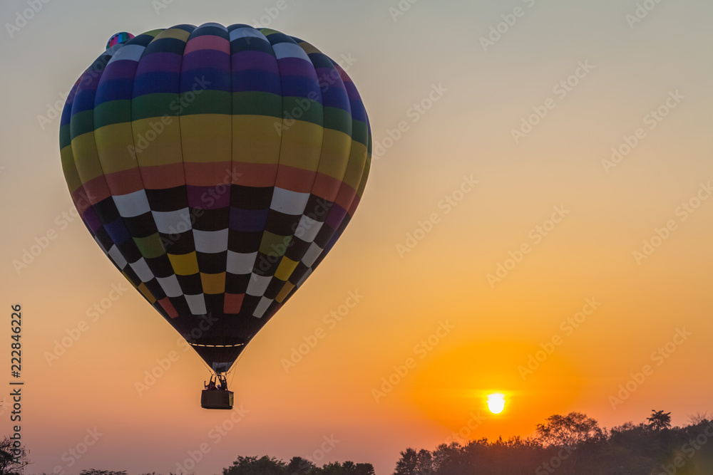 Fototapeta premium sweet sunrise on the back of hot air balloons festival at Shingha Park in Chiang Rai.