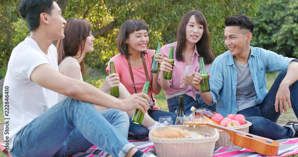 Asian Young friends enjoy the picnic time in the park Asian Young friends enjoy the picnic time in the park