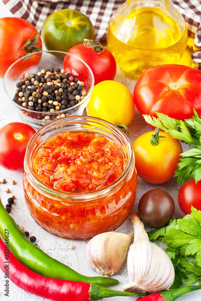Tomato paste, sauce in glass jar and fresh tomatoes Tomato paste, sauce in glass jar and fresh tomatoes