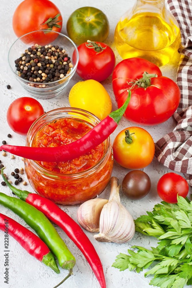 Tomato paste, sauce in glass jar and fresh tomatoes Tomato paste, sauce in glass jar and fresh tomatoes