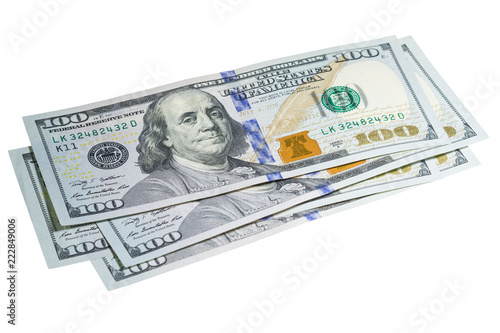 Stack of one hundred dollar banknotes close up isolated on white background