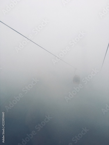 on the cable car through the clouds climb the mountains abstraction in the style of silent hill
