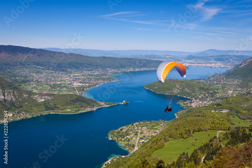 Lake Annecy (Lac Annecy) in French Apls, France. View of the Annecy lake from Col du Forclaz. Paragliders with parapente jumping of Col de Forclaz near Annecy in French Alps, in France.