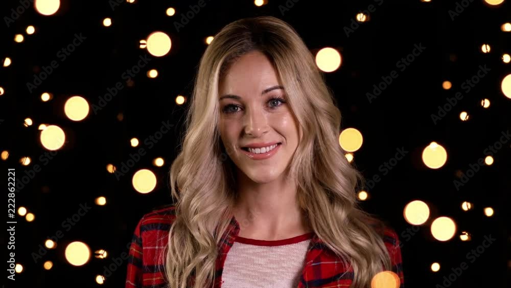 Portrait of a smiling and happy woman getting ready for Christmas. Portrait of a smiling and happy woman getting ready for Christmas.