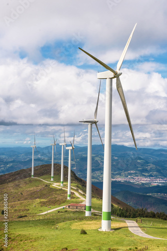 Renewable energy. Wind turbines, eolic park in scenic landscape of basque country, Spain.