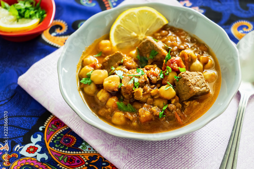 Moroccan lentil soup harira with meat, chickpeas, tomato and spices.