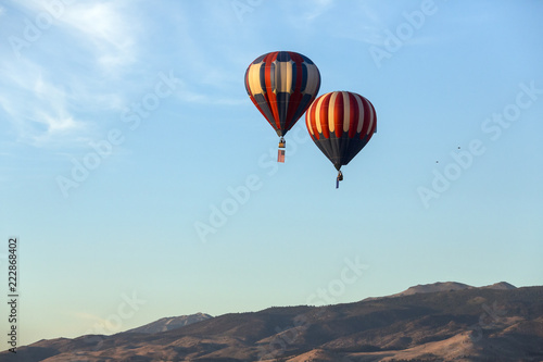 American flag and Nevada state flag flying with hot air balloons © ecummings00