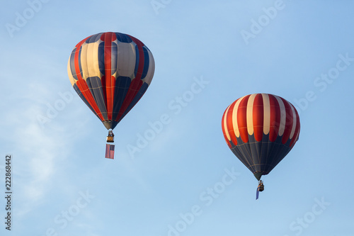 American flag and Nevada state flag flying with hot air balloons © ecummings00