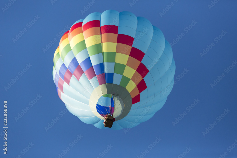 Fototapeta premium Hot air balloons flying in a beautiful blue clear sky