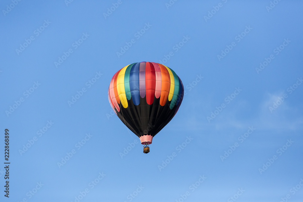 Hot air balloons flying in a beautiful blue clear sky Hot air balloons flying in a beautiful blue clear sky