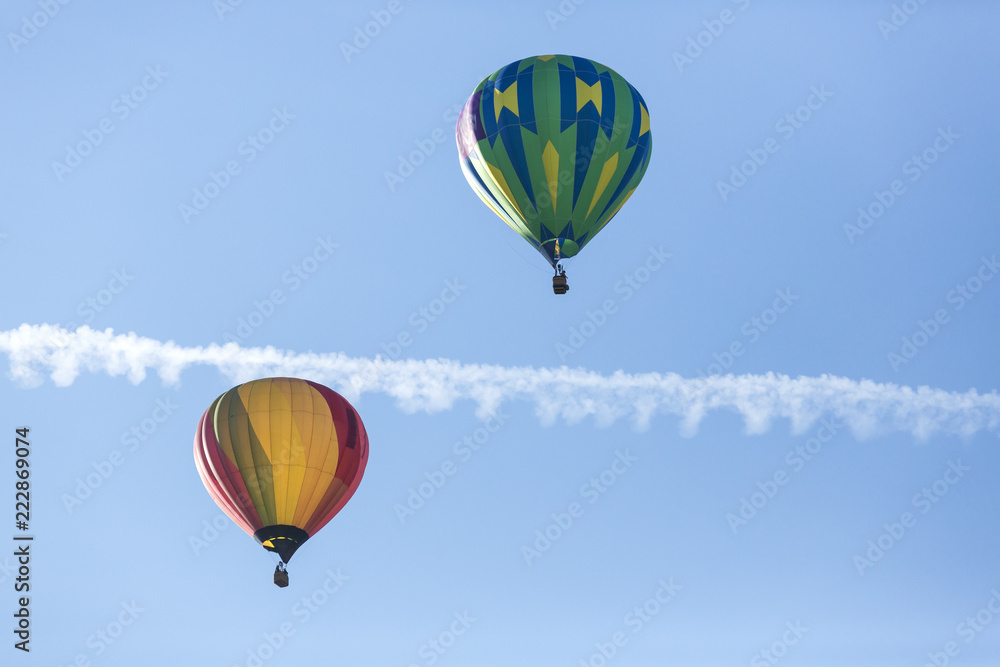 Hot air balloons flying in a beautiful blue clear sky