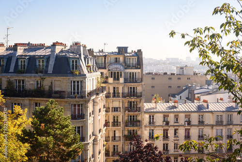 Paris, France. View on French Parisian apartments  and  flats with typcial balconies. Cityscape panorama from park in front of Sacre Coeur in Paris, France.