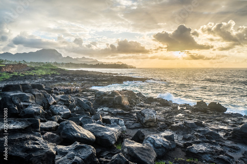 Sunrise on southern Kauai shoreline with Haupu Mountain in the background
