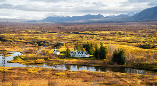 plain thingvellir national park in reykjavik enters to the iceland golden circle. countryside with river, church, houses on mountain landscape in Iceland. best vacations. perfect morning. photo