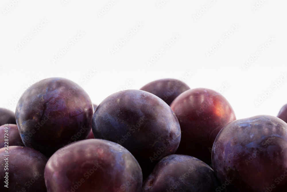 Fruit plums on white background