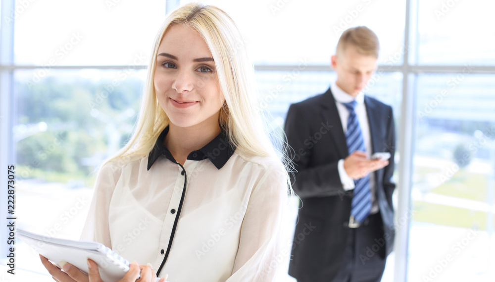 Happy modern business woman or student girl in office hall Happy modern business woman or student girl in office hall