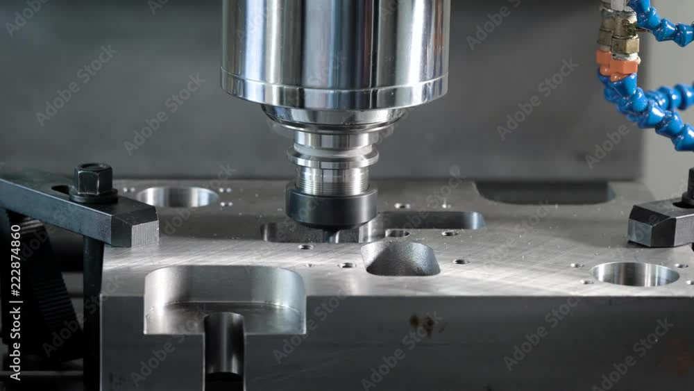 detail is fixed on a moving platform of automatic cutting machine in a shop of factory, close-up of process detail is fixed on a moving platform of automatic cutting machine in a shop of factory, close-up of process