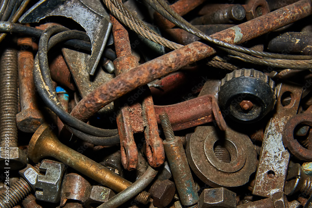 Rusty bolts and tools in metal box closeup. Selective focus. Rusty bolts and tools in metal box closeup. Selective focus.