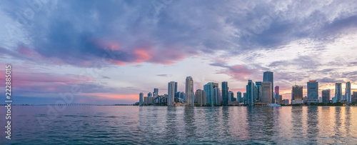 Miami, wide panorama of urban skyline at beautiful sunset, vivid and dramatic sky © DarwelShots