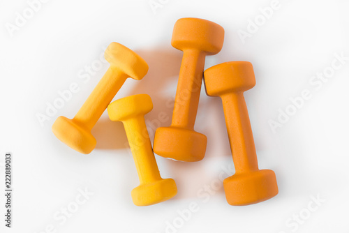 Yellow and orange dumbbells