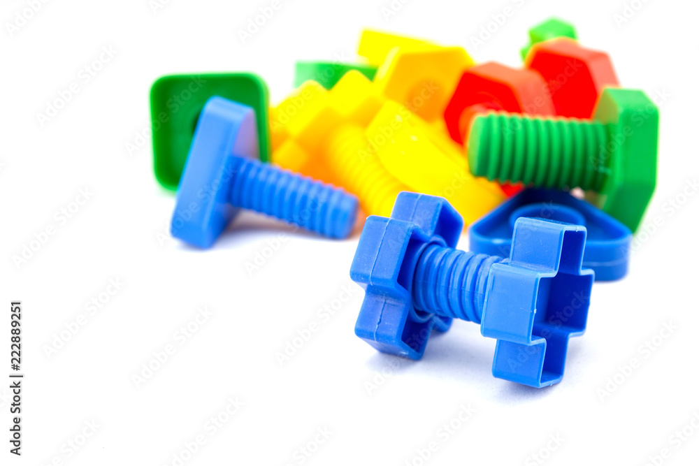 Colorful and funny nuts and bolts toys isolated on white background Colorful and funny nuts and bolts toys isolated on white background