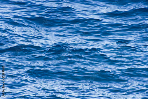 Close-up view of some beautiful blue waves in Sardinia  Italy.