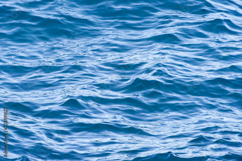 Close-up view of some beautiful blue waves in Sardinia, Italy.
